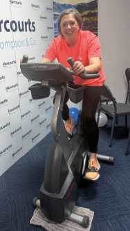 Michelle on a training bike for the Blue September ride