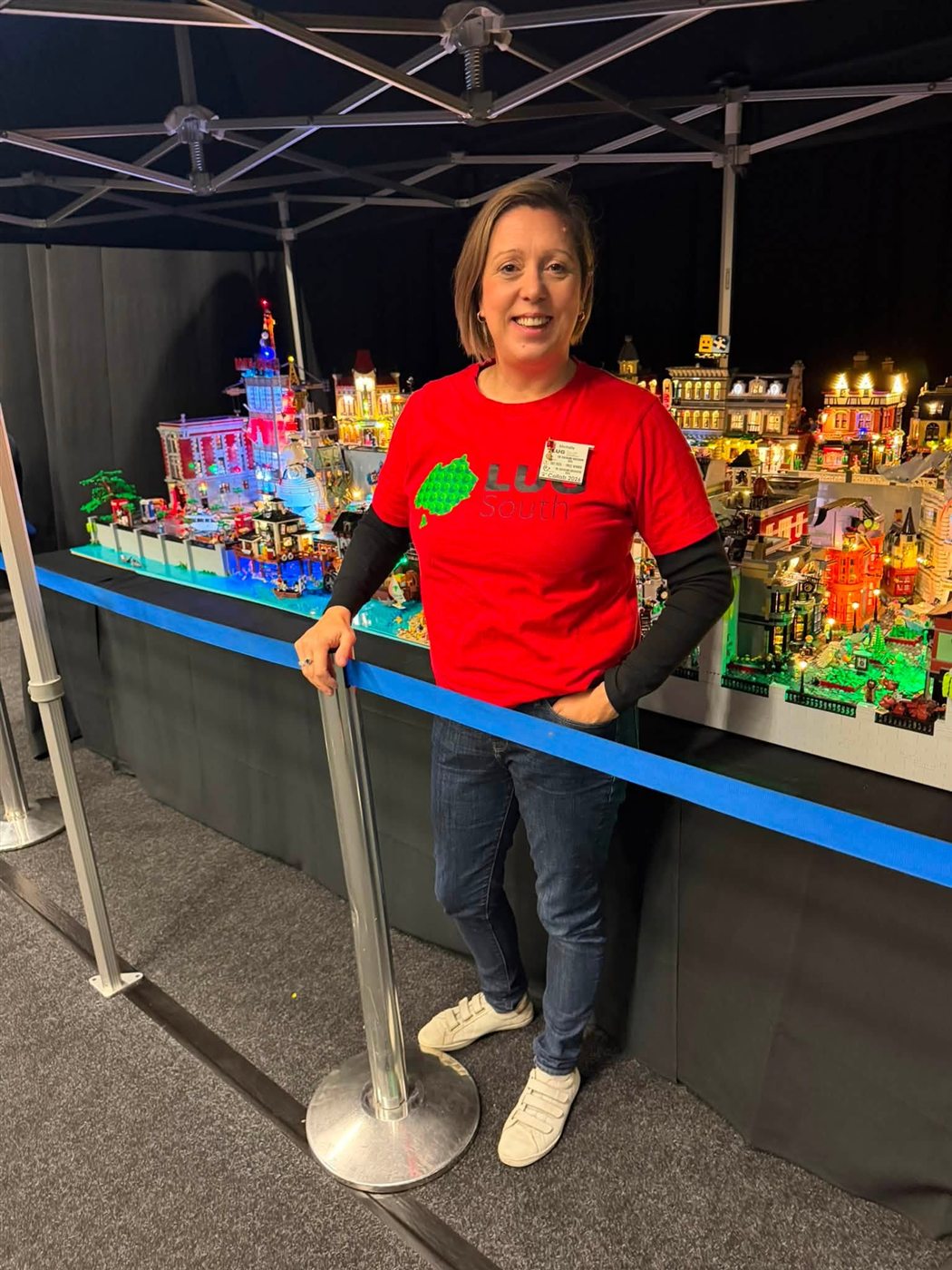 Michelle beside the LEGO display